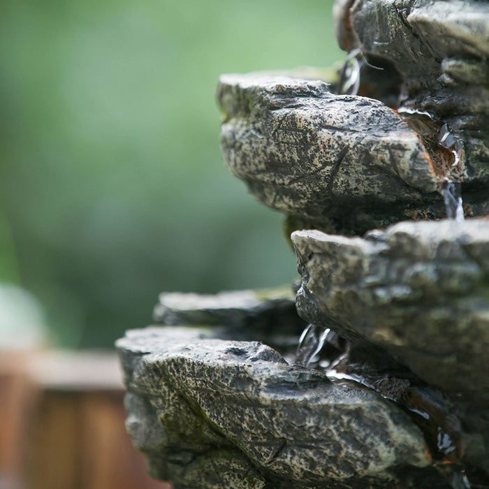 Indoor Stone-Look Water Fountain, 7 Tier Polyresin Cascading Rock Tabletop Fountain With LED Light - Gray